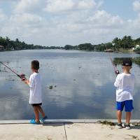 Two kids fishing at Memorial Park during the fishing camp