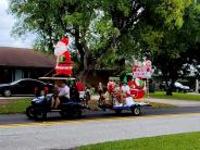 Entry 30, A golf cart with a Santa inflatable pulling a sleigh