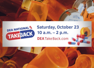 Prescription bottles in background. Banner reads "DEA National Rx Take Back, Saturday October 23, 10 am- 2 pm. DEATakeback.com"
